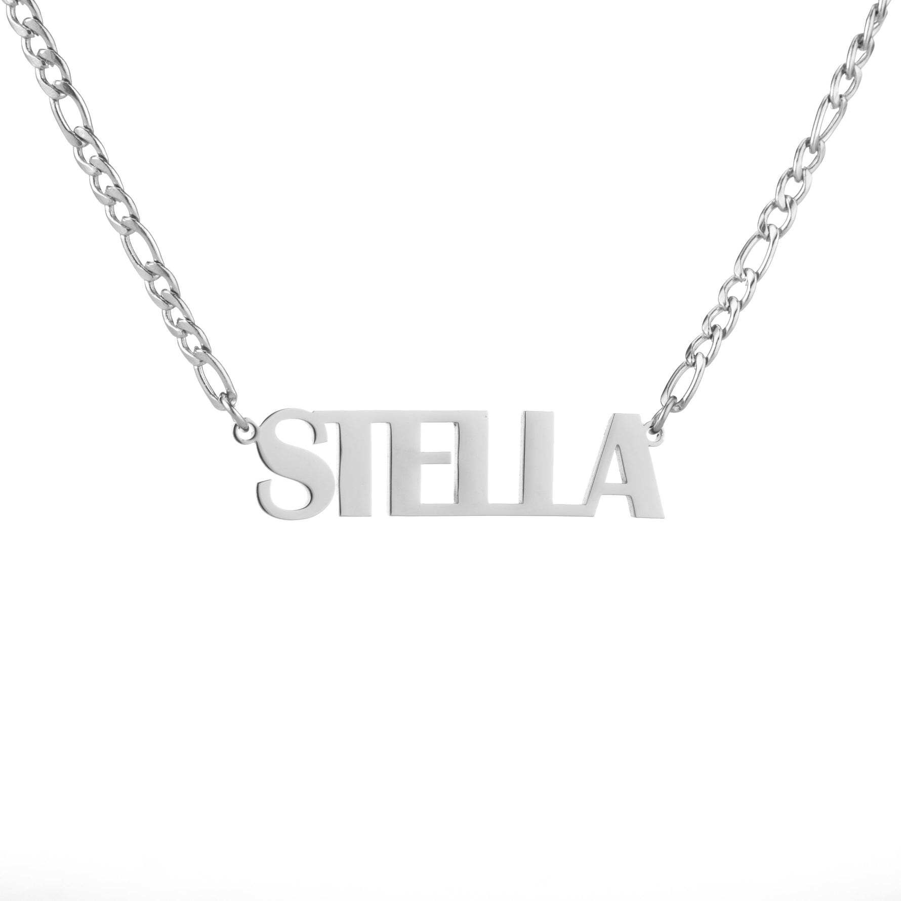 A silver-colored necklace with the name 'STELLA' written in bold, all-capital letters.