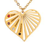 Gold heart-shaped necklace with engraved names and colored stones on a white background