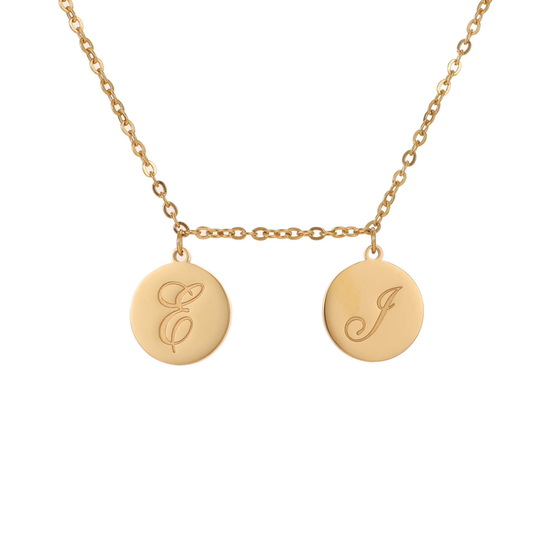 A gold-toned initial custom pendant necklace with two round discs with engraved letters.
