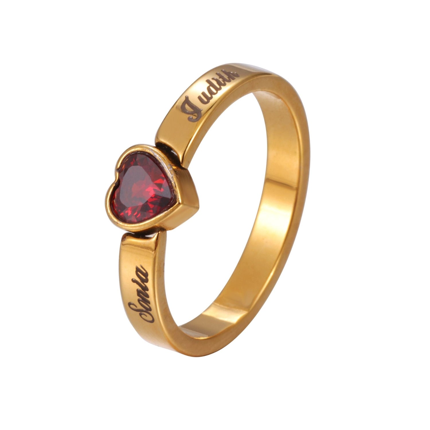 Gold ring with a red heart-shaped gemstone on a white background