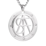Silver necklace with a circular pendant on a white background