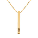 A gold-colored 3D bar necklace on a chain, with japanese engravings on the bar.