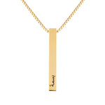 A gold-colored stainless steel bar necklace with an adjustable length and a personalized arabic text tag attached to it.